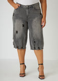 Mid-rise distressed stretch-denim capris with frayed trims. Classic five pockets. Button and zip fastenings at front.