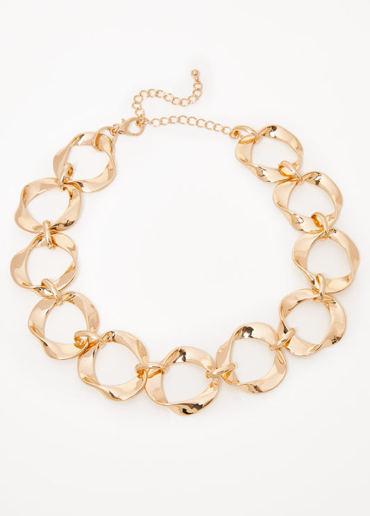 Necklace with twisted rings in gold-tone metal. Lobster-clasp fastening.