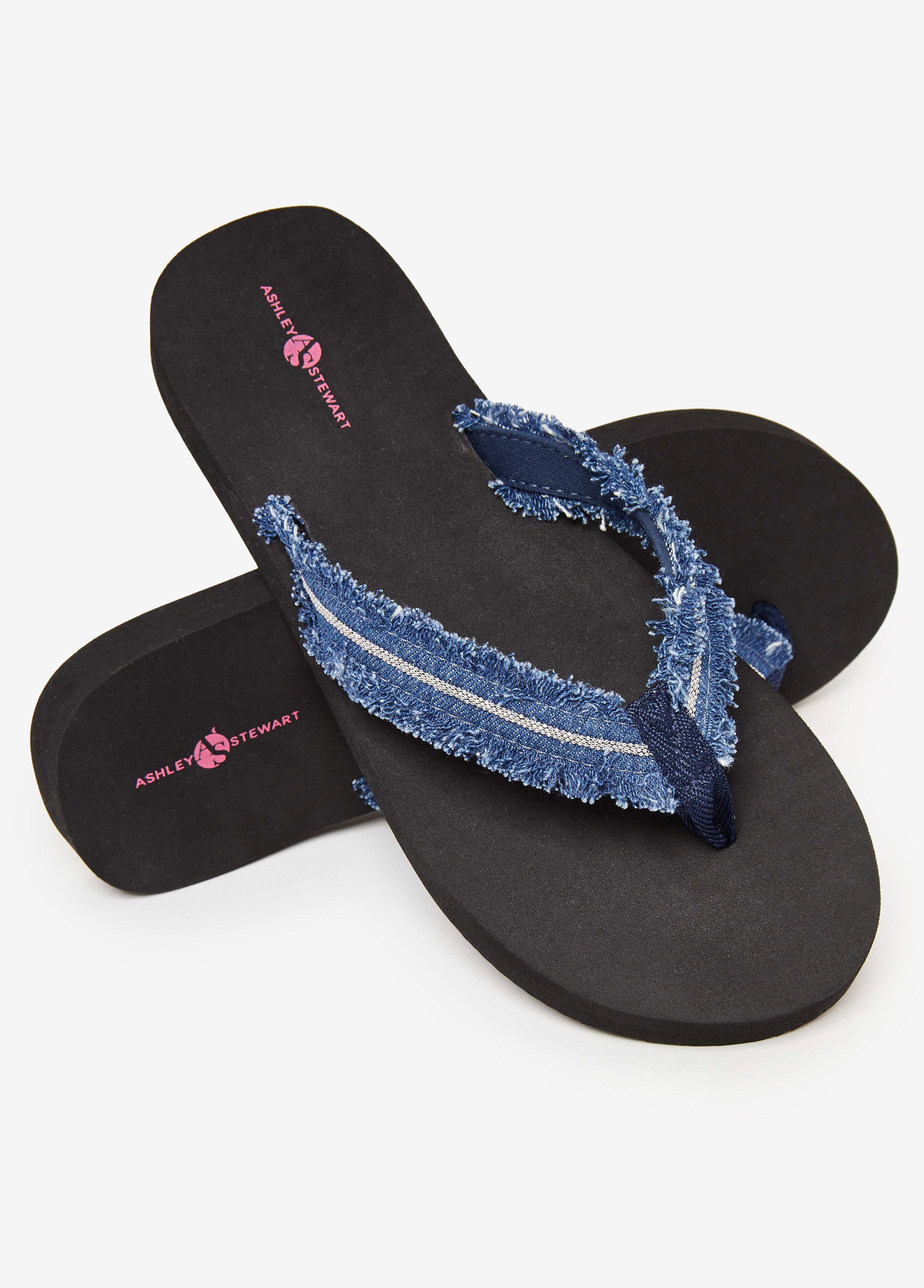 Round-toe flip flops with thong strap, crystal embellishments, frayed denim trims and wedge heel. Slip-on style. Heel Height: 1in.