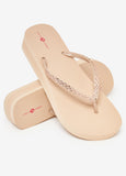 Round-toe flip flops thong strap, crystal embellishments and wedge heel. Slip-on style. Heel Height: 1.5in.